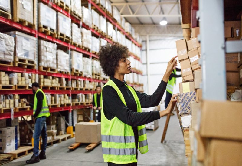 Image of a warehouse worker in a high-vis vest
